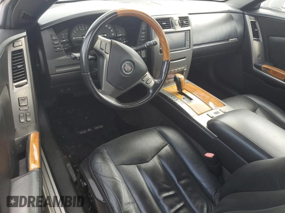 2004 Cadillac XLR z VIN 1G6YV34A945601007, wystawiony jako Copart lot #77077394 z przebiegiem Nie podano mil oraz Szkody całkowita. Historia ofert i sprzedaży dostępna na DreamBid. Obrazek 8.