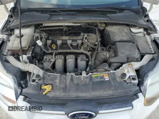 2013 Ford Focus SE z VIN 1FADP3F2XDL198801, wystawiony jako Copart lot #51985455 z przebiegiem 115 747 mil mil oraz Szkoda całkowita • Salvage title. Historia ofert i sprzedaży dostępna na DreamBid. Obrazek 11.
