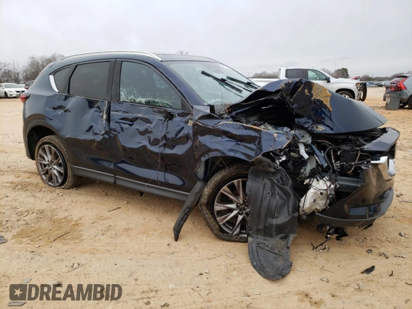 2019 Mazda CX-5 Grand Touring with VIN JM3KFADM0K1596256, listed as a Copart auction lot 86323594 with 118,853 mi miles and Salvage title. Bid and sale history available at DreamBid. Image 4.