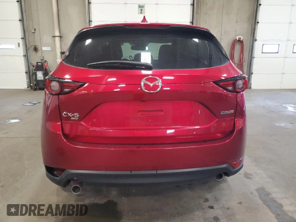 2020 Mazda CX-5 Grand Touring with VIN JM3KFBDM9L0760861, listed as a Copart auction lot 60977275 with 58,608 mi miles and Salvage title. Bid and sale history available at DreamBid. Image 6.