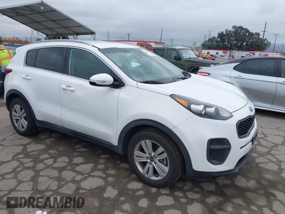2018 Kia Sportage LX with VIN KNDPM3AC1J7413227, listed as a IAAI auction lot 42188566 with 77,897 mi miles and . Bid and sale history available at carsss.com. Image 1.