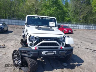2017 Jeep Wrangler Unlimited Rubicon with VIN 1C4BJWFG9HL695361, listed as a IAAI auction lot 42010655 with 65,536 mi miles and . Bid and sale history available at DreamBid. Image 12.