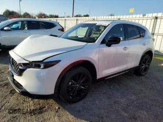 2022 Mazda CX-5 2.5 Turbo with VIN JM3KFBAY7N0597010, listed as a Copart auction lot 83062114 with 18,136 mi miles and Salvage Title. Bid and sale history available at carsss.com. Image 1.