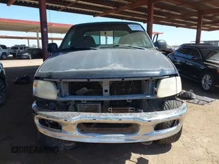 2000 Ford F-150 XL z VIN 1FTRX18L1YNA05567, wystawiony jako IAAI lot #42054536 z przebiegiem 245 018 mil mil oraz . Historia ofert i sprzedaży dostępna na DreamBid. Obrazek 12.