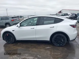 2022 Tesla Model Y Long Range z VIN 7SAYGDEE2NF420882, wystawiony jako IAAI lot #42023642 z przebiegiem 19 783 mil mil oraz . Historia ofert i sprzedaży dostępna na DreamBid. Obrazek 14.
