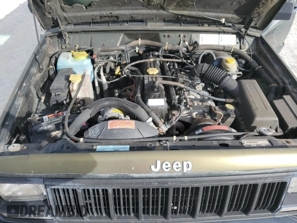 1996 Jeep Cherokee SE z VIN 1J4FJ28S9TL211073, wystawiony jako Copart lot #78052574 z przebiegiem 174 967 mil mil oraz Nie do naprawy • Non repairable. Historia ofert i sprzedaży dostępna na DreamBid. Obrazek 12.