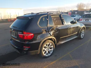 2011 BMW X5 35i with VIN 5UXZV4C54BL402935, listed as a IAAI auction lot 41198827 with 120,157 mi miles. Bid and sale history available at carsss.com. Image 4.