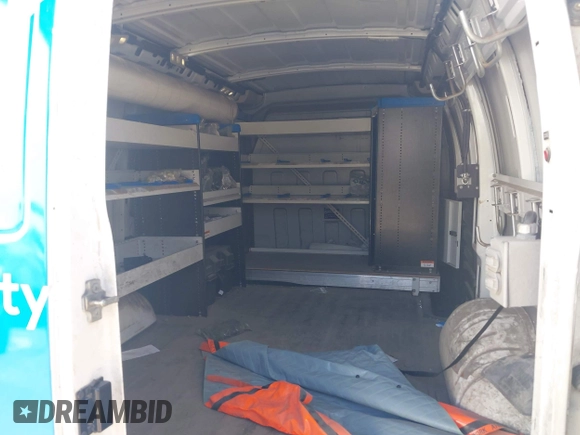 2015 Chevrolet Express Cargo Van with VIN 1GCWGFCF9F1167677, listed as a IAAI auction lot 42018087 with 148,263 mi miles. Bid and sale history available at carsss.com. Image 8.