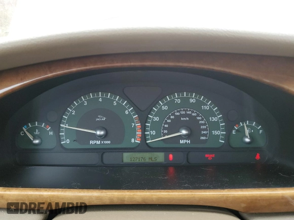 2003 Jaguar S-Type z VIN SAJEA01U33HM71782, wystawiony jako Copart lot #82969304 z przebiegiem 127 176 mil mil oraz Szkody całkowita. Historia ofert i sprzedaży dostępna na DreamBid. Obrazek 9.