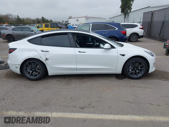 2023 Tesla Model 3 with VIN 5YJ3E1EA5PF505856, listed as a IAAI auction lot 41885837 with 28,206 mi miles and . Bid and sale history available at carsss.com. Image 12.
