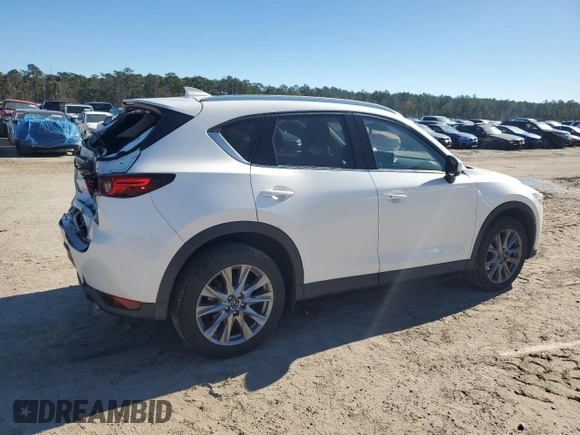 2021 Mazda CX-5 Grand Touring with VIN JM3KFBDM0M1440565, listed as a Copart auction lot 87089404 with 34,607 mi miles and Salvage Title. Bid and sale history available at carsss.com. Image 3.