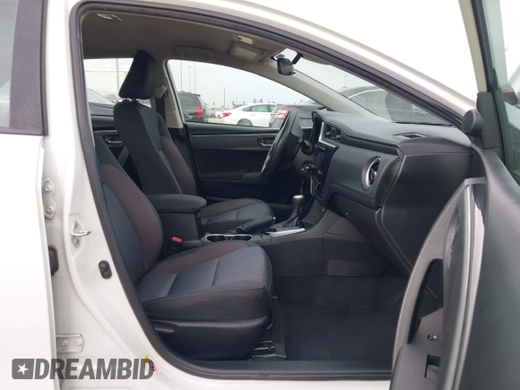 2019 Toyota Corolla L with VIN 5YFBURHE1KP930676, listed as a IAAI auction lot 41940047 with 82,885 mi miles. Bid and sale history available at carsss.com. Image 5.