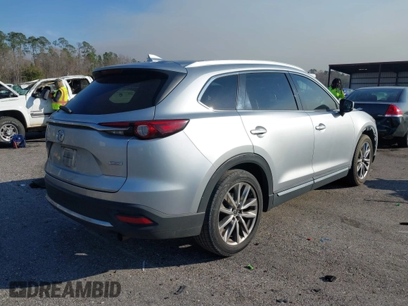 2017 Mazda CX-9 Grand Touring with VIN JM3TCADY5H0138176, listed as a IAAI auction lot 41458610 with 114,664 mi miles and . Bid and sale history available at DreamBid. Image 4.