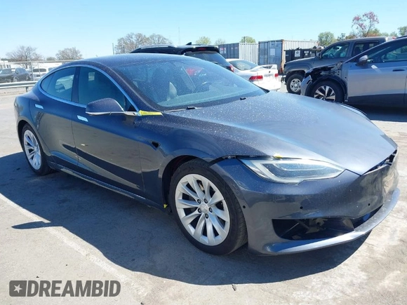 2017 Tesla Model S 100D with VIN 5YJSA1E20HF198503, listed as a IAAI auction lot 41843782 with 77,281 mi miles and . Bid and sale history available at DreamBid. Image 1.