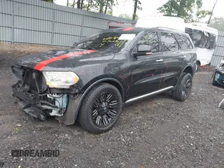 2013 Dodge Durango Crew with VIN 1C4RDJDG8DC675527, listed as a IAAI auction lot 42452197 with 184,981 mi miles and . Bid and sale history available at DreamBid. Image 2.