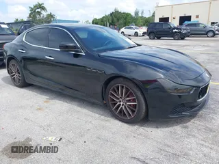 2015 Maserati Ghibli with VIN ZAM57XSA1F1144073, listed as a IAAI auction lot 42770723 with 105,782 mi miles and . Bid and sale history available at DreamBid. Image 1.