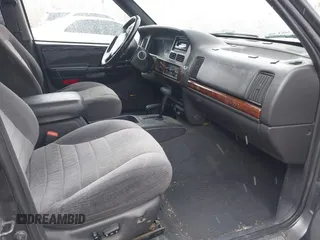 1997 Jeep Grand Cherokee Laredo with VIN 1J4GZ58Y8VC624804, listed as a IAAI auction lot 41736324 with 165,851 mi miles. Bid and sale history available at carsss.com. Image 5.