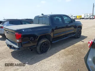 2018 Toyota Tacoma SR with VIN 5TFAX5GN5JX126118, listed as a IAAI auction lot 41949791 with 37,615 mi miles and . Bid and sale history available at DreamBid. Image 4.