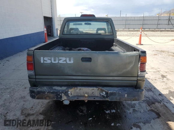 1994 Isuzu Pickup S z VIN JAACL11L2R7221226, wystawiony jako Copart lot #59027295 z przebiegiem 129 494 mil mil oraz Tytuł czysty. Historia ofert i sprzedaży dostępna na DreamBid. Obrazek 6.