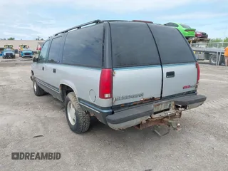 1994 GMC Suburban z VIN 1GKEC16K2RJ750376, wystawiony jako IAAI lot #42278734 z przebiegiem 185 403 mil mil oraz . Historia ofert i sprzedaży dostępna na DreamBid. Obrazek 3.