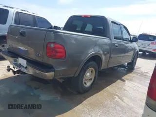 2003 Ford F-150 XLT with VIN 1FTRW076X3KA76379, listed as a IAAI auction lot 41821131 with 221,081 mi miles. Bid and sale history available at carsss.com. Image 4.