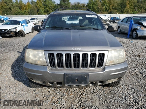 1999 Jeep Grand Cherokee Limited with VIN 1J4G268S7XC668348, listed as a Copart auction lot 77824084 with 165,779 mi miles and Salvage title. Bid and sale history available at DreamBid. Image 5.