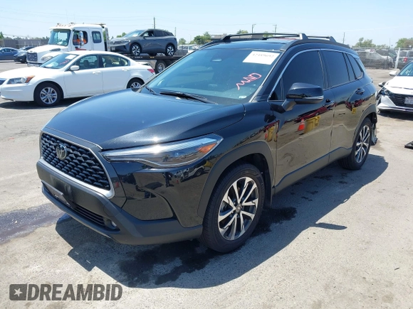 2023 Toyota Corolla Cross XLE z VIN 7MUDAAAG3PV069634, wystawiony jako IAAI lot #42489692 z przebiegiem 18 923 mil mil oraz . Historia ofert i sprzedaży dostępna na DreamBid. Obrazek 18.