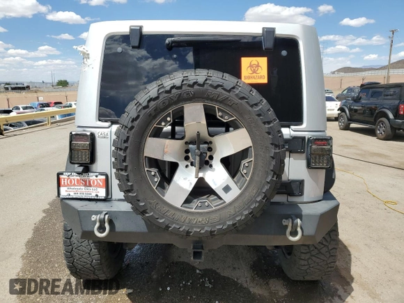 2012 Jeep Wrangler Unlimited Altitude with VIN 1C4HJWEG8CL163653, listed as a Copart auction lot 55279045 with 107,076 mi miles and Salvage title. Bid and sale history available at DreamBid. Image 6.