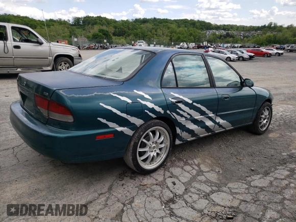 1997 Mitsubishi Galant ES z VIN 4A3AJ56G5VE019296, wystawiony jako Copart lot #56047635 z przebiegiem 87 533 mil mil oraz Szkoda całkowita • Salvage title. Historia ofert i sprzedaży dostępna na DreamBid. Obrazek 3.