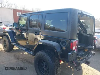 2018 Jeep Wrangler JK Unlimited Sahara with VIN 1C4HJWEG8JL921293, listed as a IAAI auction lot 41413264 with 90,566 mi miles. Bid and sale history available at carsss.com. Image 3.