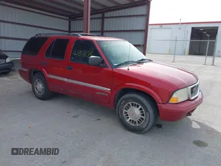 1999 GMC Jimmy SLE with VIN 1GKDT13W3X2504723, listed as a IAAI auction lot 41858184 with 239,227 mi miles. Bid and sale history available at carsss.com. Image 1.