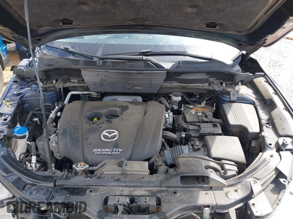 2018 Mazda CX-5 Grand Touring z VIN JM3KFADM8J1406007, wystawiony jako IAAI lot #42008567 z przebiegiem 110 661 mil mil oraz . Historia ofert i sprzedaży dostępna na DreamBid. Obrazek 10.