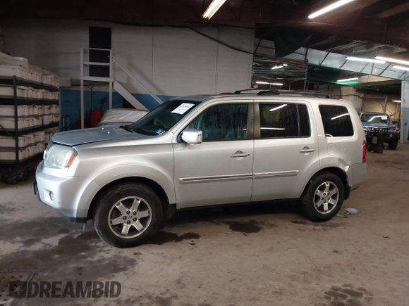 2009 Honda Pilot Touring with VIN 5FNYF48929B010331, listed as a IAAI auction lot 41965094 with 142,490 mi miles and . Bid and sale history available at carsss.com. Image 14.