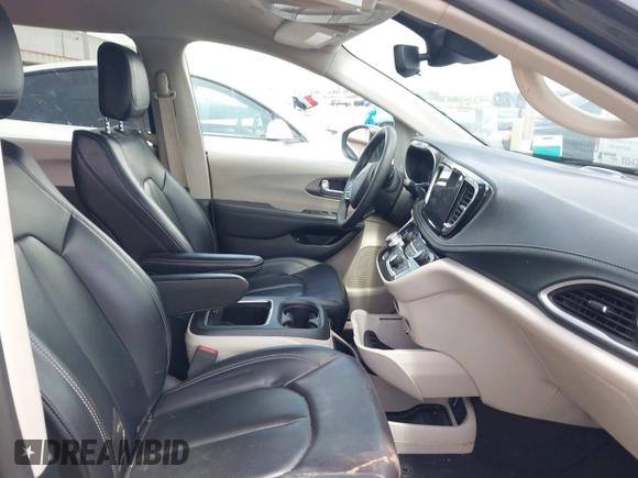 2023 Chrysler Pacifica Hybrid Touring L with VIN 2C4RC1L70PR622000, listed as a IAAI auction lot 42711826 with 65,109 mi miles and . Bid and sale history available at DreamBid. Image 5.