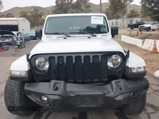 2021 Jeep Gladiator Willys with VIN 1C6HJTAG1ML572638, listed as a IAAI auction lot 42065562 with 43,040 mi miles and . Bid and sale history available at DreamBid. Image 12.