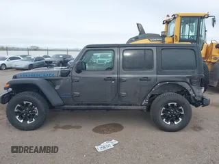 2024 Jeep Wrangler Rubicon z VIN 1C4RJXR67RW276710, wystawiony jako IAAI lot #42047318 z przebiegiem 35 857 mil mil oraz . Historia ofert i sprzedaży dostępna na DreamBid. Obrazek 14.
