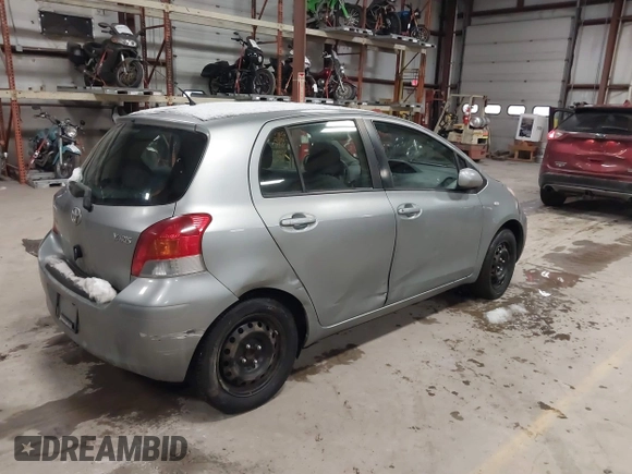 2009 Toyota Yaris with VIN JTDKT903695262863, listed as a IAAI auction lot 41456767 with 206,534 mi miles and . Bid and sale history available at DreamBid. Image 4.