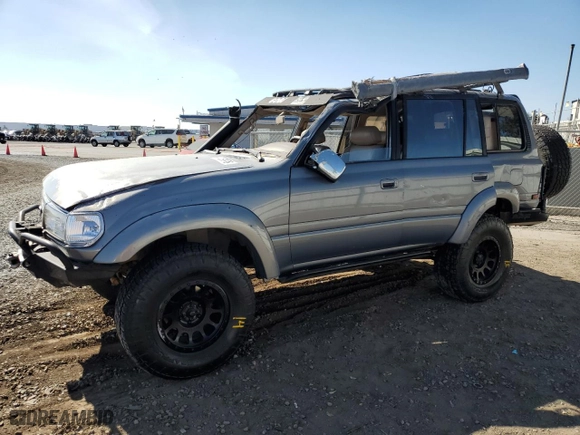 1996 Toyota Land Cruiser with VIN JT3HJ85J0T0145838, listed as a Copart auction lot 77593764 with 158,507 mi miles and Salvage Title. Bid and sale history available at carsss.com. Image 1.
