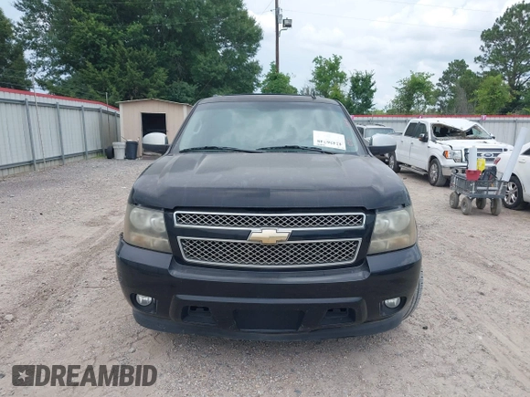 2011 Chevrolet Suburban LT with VIN 1GNSCJE07BR128885, listed as a IAAI auction lot 42456748 with 201,789 mi miles and . Bid and sale history available at DreamBid. Image 12.