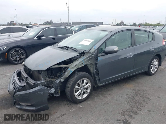 2011 Honda Insight EX z VIN JHMZE2H72BS001792, wystawiony jako IAAI lot #42207415 z przebiegiem 131 792 mil mil oraz . Historia ofert i sprzedaży dostępna na DreamBid. Obrazek 2.