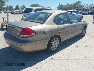 2006 Ford Taurus SE with VIN 1FAFP53U96A223924, listed as a IAAI auction lot 41828443 with 114,653 mi miles. Bid and sale history available at carsss.com. Image 4.