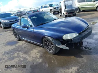 2003 Mazda MX-5 Miata Cloth with VIN JM1NB353230300759, listed as a IAAI auction lot 41803742 with 157,934 mi miles and . Bid and sale history available at DreamBid. Image 1.