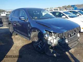 2018 Mazda CX-5 Grand Touring with VIN JM3KFADM9J1328501, listed as a IAAI auction lot 41408154 with 116,679 mi miles. Bid and sale history available at carsss.com. Image 1.