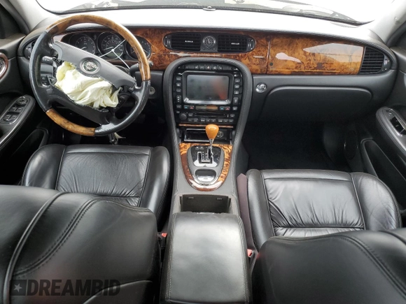 2004 Jaguar XJ with VIN SAJEA74C34SG09548, listed as a Copart auction lot 71754774 with 142,804 mi miles and Salvage Title. Bid and sale history available at DreamBid. Image 8.