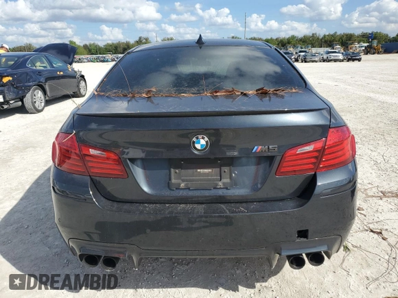2014 BMW M5 with VIN WBSFV9C54ED097865, listed as a Copart auction lot 79897384 with 0 mi miles and Salvage Title. Bid and sale history available at carsss.com. Image 6.
