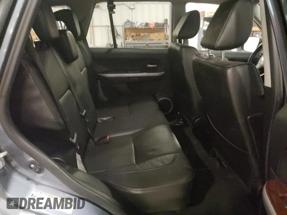 2007 Suzuki Grand Vitara Luxury z VIN JS3TD947774200407, wystawiony jako Copart lot #52001965 z przebiegiem Nie podano mil oraz Szkoda całkowita • Salvage title. Historia ofert i sprzedaży dostępna na DreamBid. Obrazek 12.