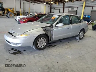 2001 Saturn LS z VIN 1G8JU52F51Y503642, wystawiony jako Copart lot #74667034 z przebiegiem 142 293 mil mil oraz Szkody całkowita. Historia ofert i sprzedaży dostępna na DreamBid. Obrazek 1.