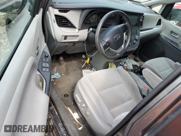 2016 Toyota Sienna LE with VIN 5TDJK3DC3GS134674, listed as a Copart auction lot 67357104 with 105,079 mi miles and Salvage Title. Bid and sale history available at carsss.com. Image 8.