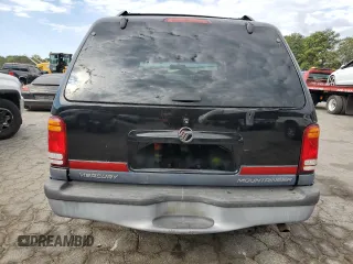 1999 Mercury Mountaineer z VIN 4M2DU52P9XUJ10152, wystawiony jako Copart lot #76283584 z przebiegiem 32 199 mil mil oraz Tytuł czysty. Historia ofert i sprzedaży dostępna na DreamBid. Obrazek 6.
