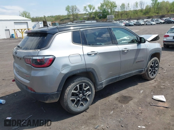 2020 Jeep Compass Trailhawk with VIN 3C4NJDDB4LT171685, listed as a IAAI auction lot 42168366 with 76,390 mi miles and . Bid and sale history available at DreamBid. Image 4.